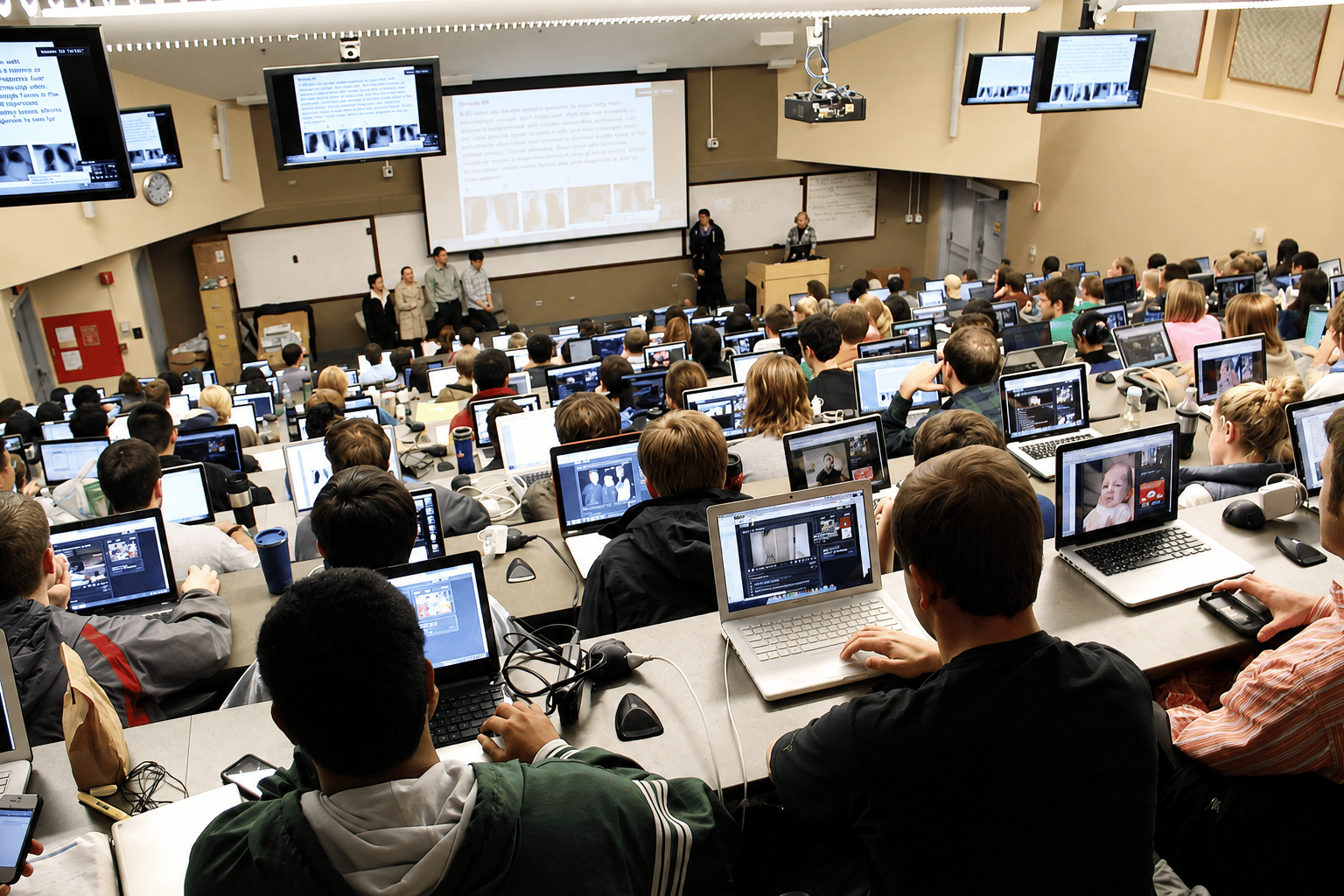 Students attending a lecture in a university classroom.